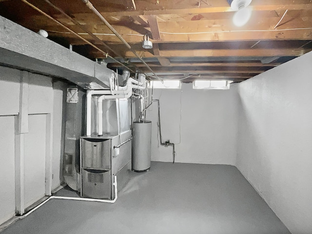 basement with heating unit and water heater