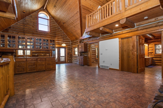 interior space featuring beamed ceiling, wood ceiling, high vaulted ceiling, and log walls