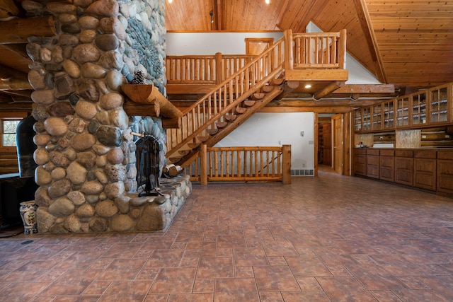 unfurnished living room with log walls, high vaulted ceiling, and wooden ceiling