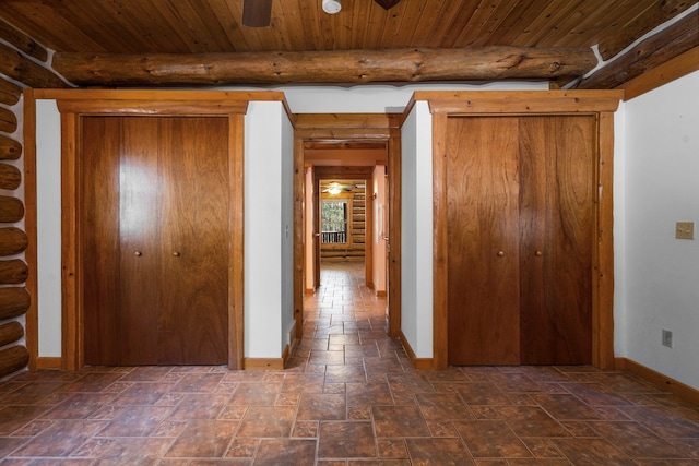 hallway featuring beamed ceiling and wood ceiling