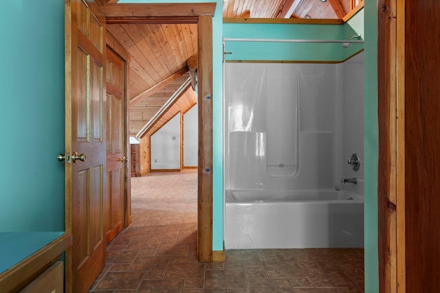 bathroom featuring bathing tub / shower combination and wooden ceiling