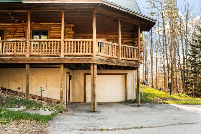 exterior space with a balcony and a garage