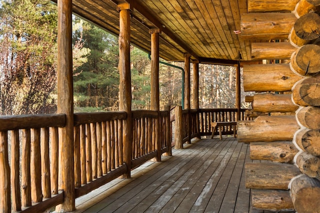 unfurnished sunroom with a wealth of natural light and wooden ceiling