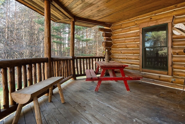 sunroom / solarium featuring wooden ceiling and vaulted ceiling