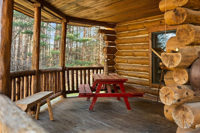 sunroom featuring a wealth of natural light and wooden ceiling