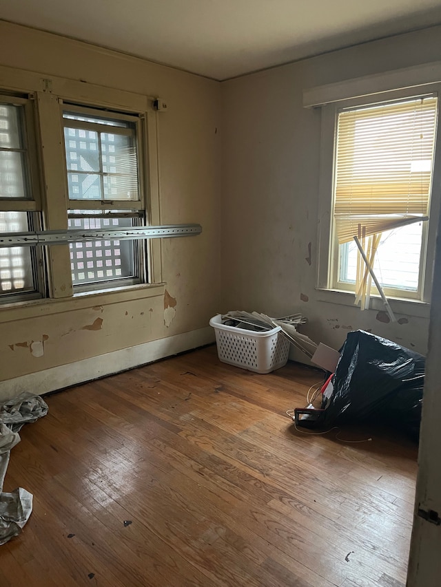 unfurnished room featuring hardwood / wood-style flooring