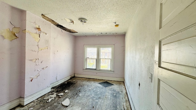 spare room featuring a textured ceiling