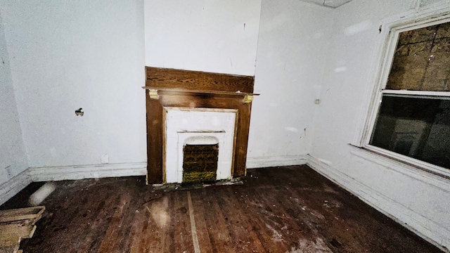 104 Mount Vernon St, Detroit, MI 48202 - unfurnished living room with wood finished floors, baseboards, and a fireplace