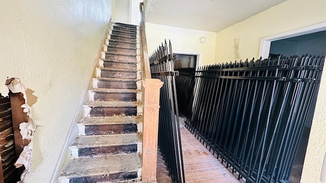 stairs with hardwood / wood-style flooring