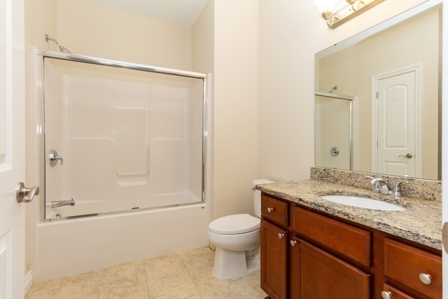 full bathroom featuring shower / bath combination with glass door, tile patterned flooring, vanity, and toilet