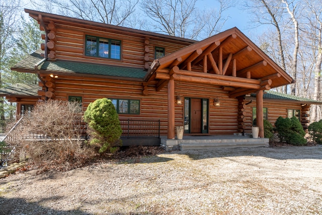 cabin featuring a porch