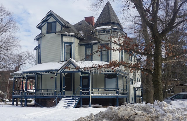 victorian-style house featuring covered porch