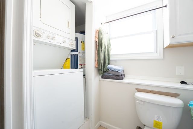 washroom featuring stacked washer and dryer