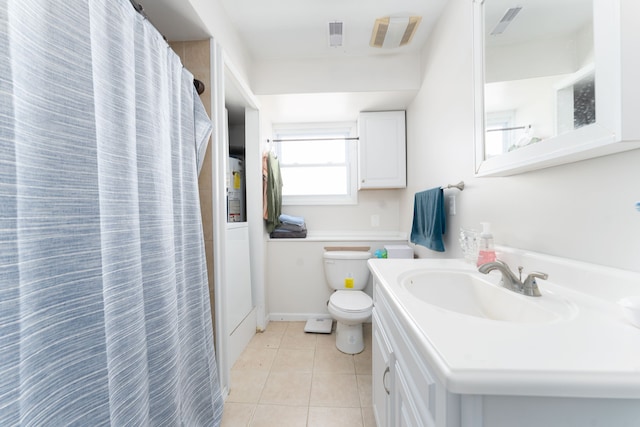 bathroom with tile patterned floors, vanity, and toilet