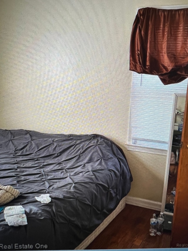 bedroom featuring dark hardwood / wood-style floors