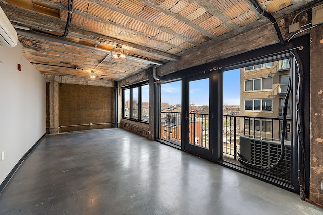 interior space with a wall mounted air conditioner