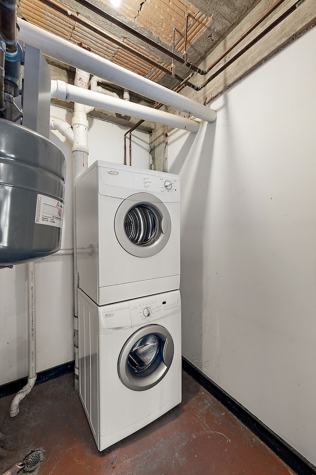 laundry room featuring stacked washer and clothes dryer