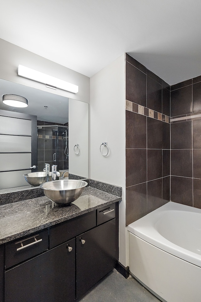 bathroom with vanity and independent shower and bath