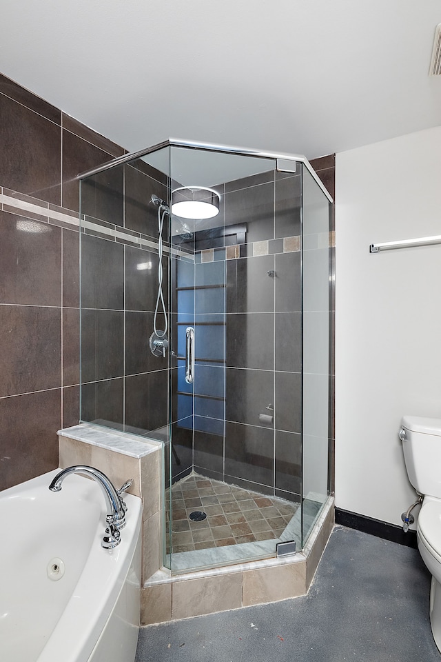 bathroom featuring plus walk in shower and toilet