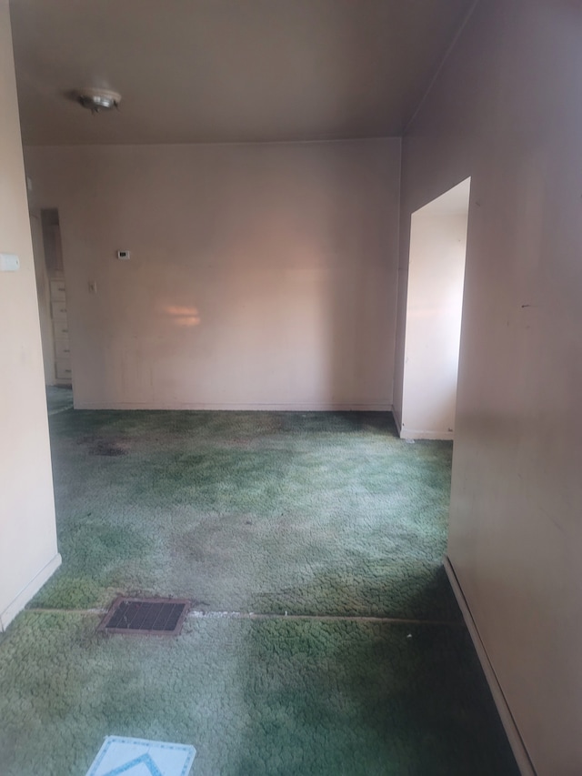 unfurnished room with carpet floors