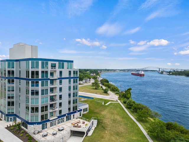 birds eye view of property with a water view