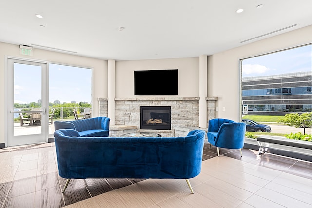 201 Beers St Unit 34, Port Huron, MI 48060 - living area featuring a stone fireplace, tile patterned floors, and recessed lighting