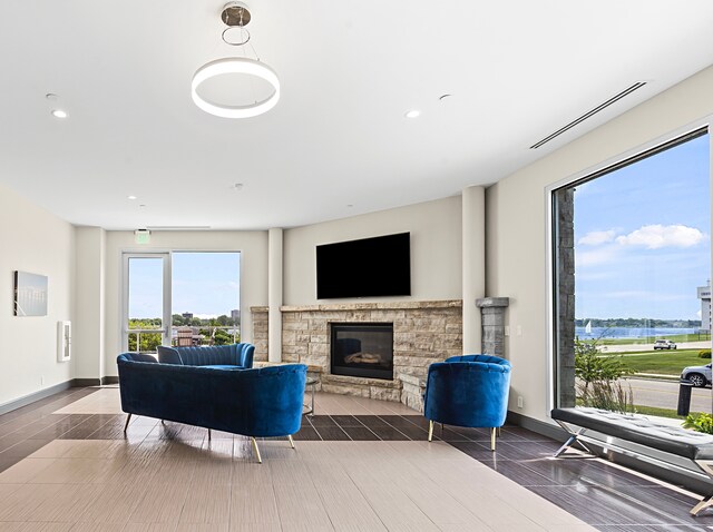201 Beers St Unit 34, Port Huron, MI 48060 - living room with a stone fireplace, recessed lighting, and baseboards