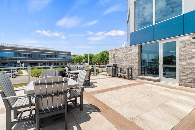 201 Beers St Unit 34, Port Huron, MI 48060 - view of patio with outdoor dining space and a grill