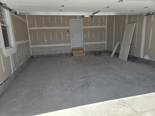 803 Plum Village Dr, Monroe, MI 48161 - garage featuring a garage door opener