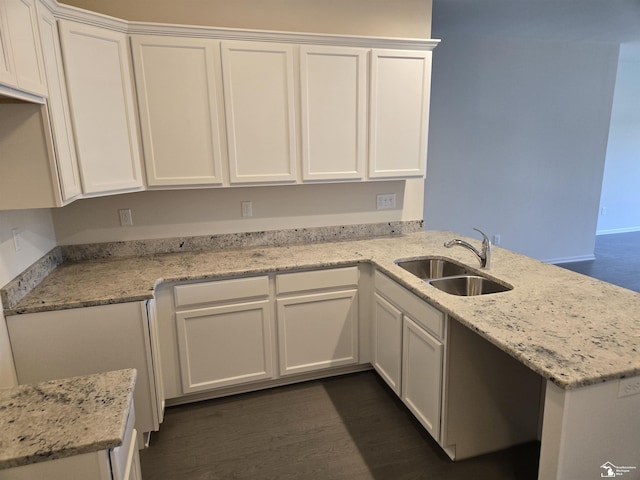 803 Plum Village Dr, Monroe, MI 48161 - kitchen featuring a sink, a peninsula, white cabinets, and light stone countertops