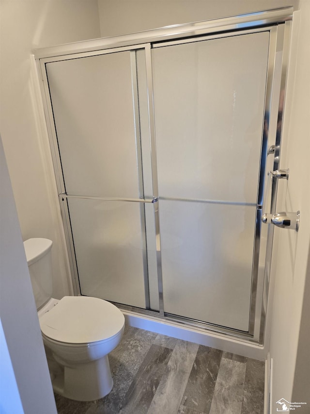 803 Plum Village Dr, Monroe, MI 48161 - bathroom featuring toilet and a stall shower