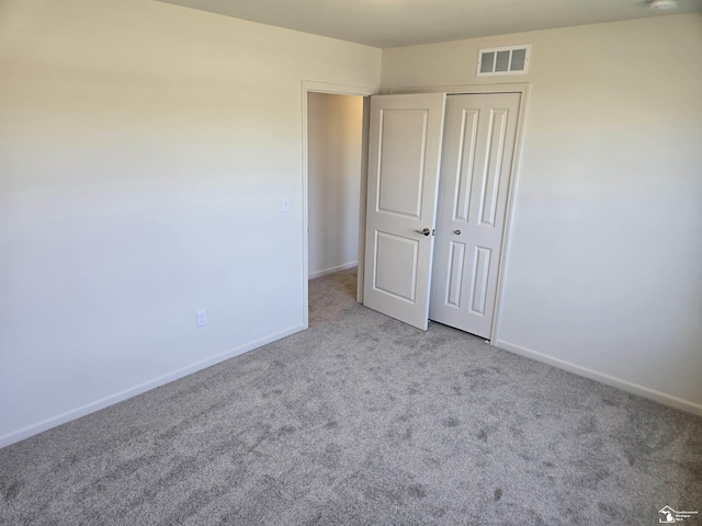 803 Plum Village Dr, Monroe, MI 48161 - unfurnished bedroom featuring carpet floors, baseboards, and a closet