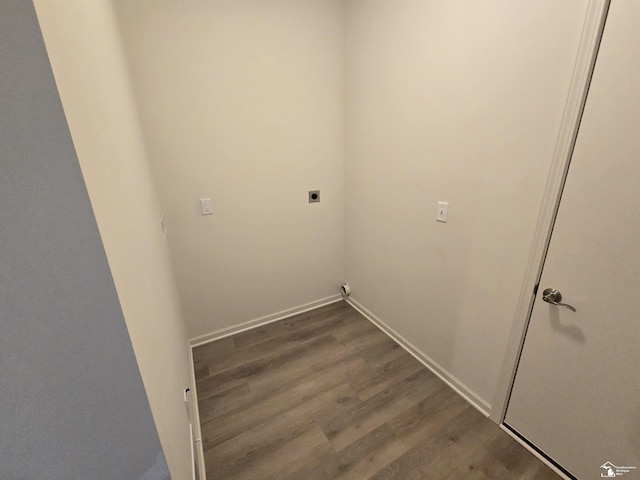 washroom featuring laundry area, dark wood-style flooring, electric dryer hookup, and baseboards