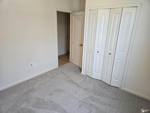 807 Plum Village Dr, Monroe, MI 48161 - unfurnished bedroom featuring carpet floors, a closet, and baseboards