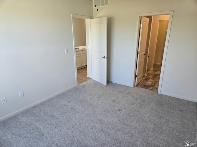 807 Plum Village Dr, Monroe, MI 48161 - unfurnished bedroom featuring light carpet and baseboards