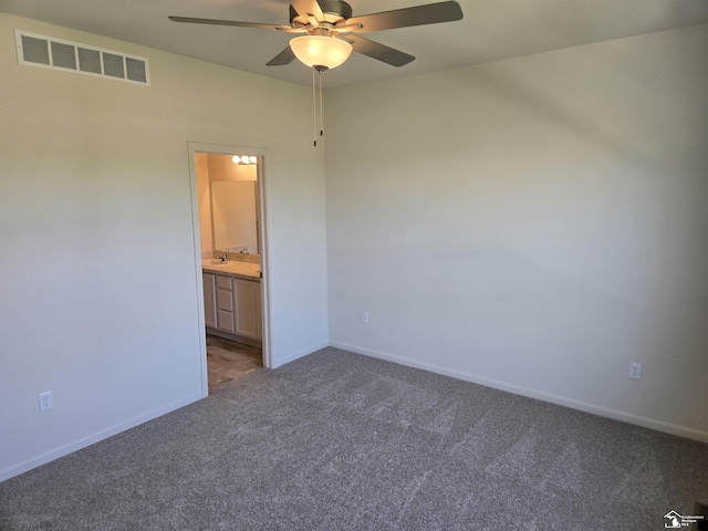 805 Plum Village Dr, Monroe, MI 48161 - carpeted spare room featuring ceiling fan, baseboards, and a sink