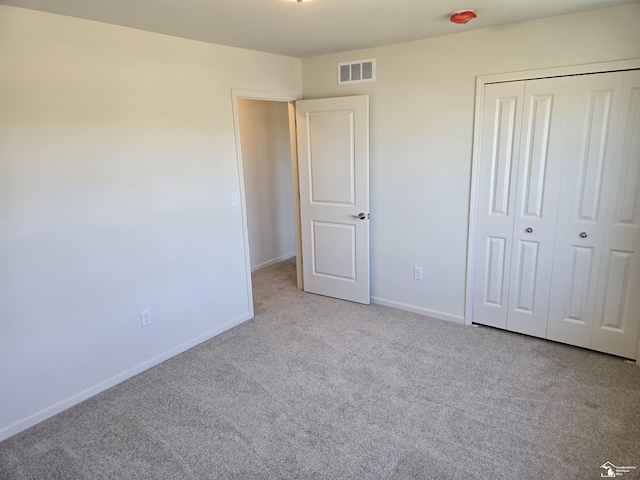 805 Plum Village Dr, Monroe, MI 48161 - unfurnished bedroom with carpet, baseboards, and a closet