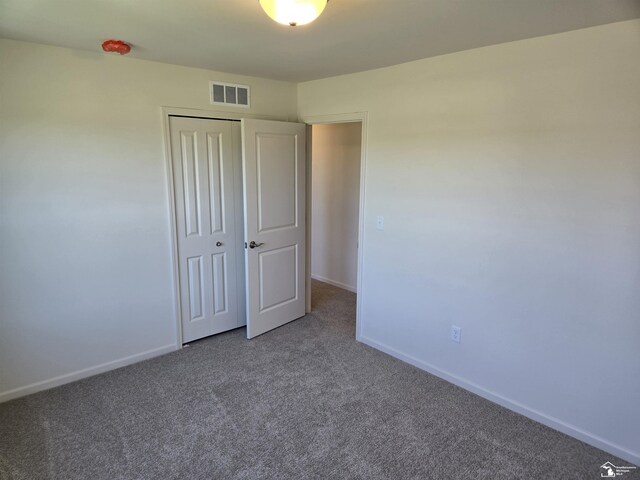 805 Plum Village Dr, Monroe, MI 48161 - unfurnished bedroom featuring carpet, baseboards, and a closet