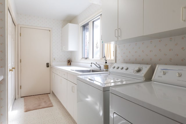 laundry area with washer and dryer, light tile patterned floors, cabinets, and sink