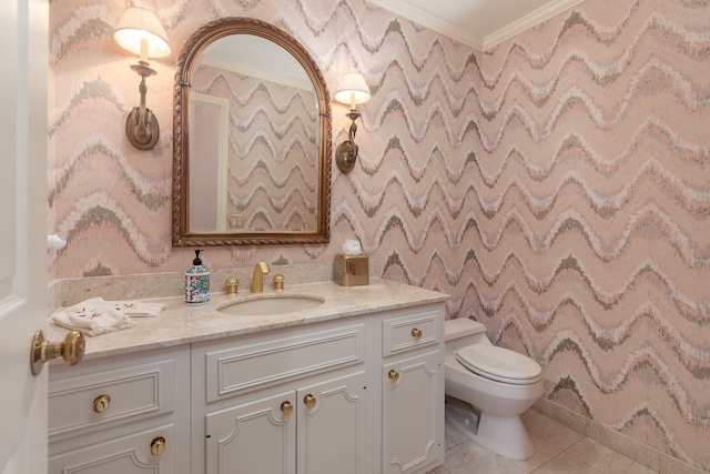 bathroom with tile patterned floors, vanity, toilet, and crown molding