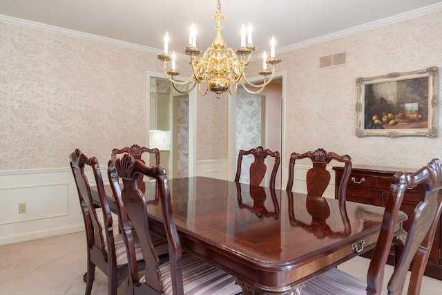 dining room with a chandelier and ornamental molding