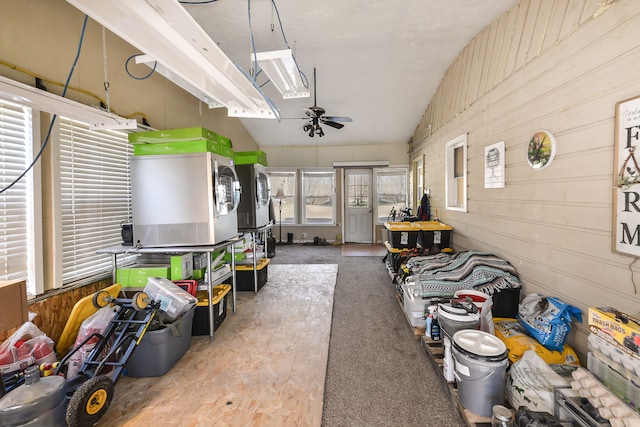 sunroom / solarium with washer / clothes dryer, ceiling fan, and lofted ceiling