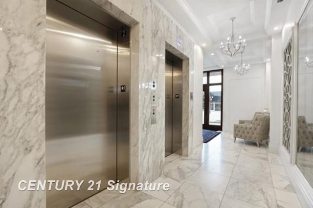 hallway with crown molding, elevator, and an inviting chandelier