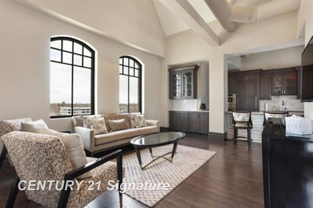 living room with dark hardwood / wood-style flooring and high vaulted ceiling