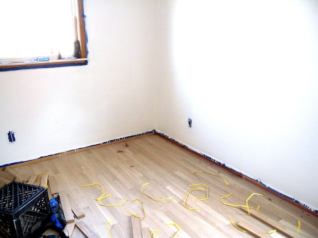 empty room featuring hardwood / wood-style flooring