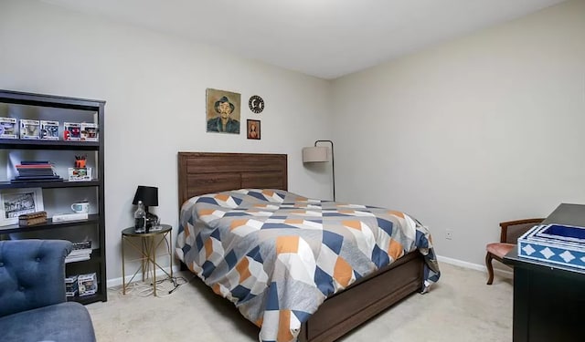 carpeted bedroom featuring baseboards