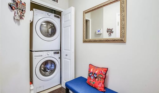 laundry area featuring laundry area and stacked washer / drying machine