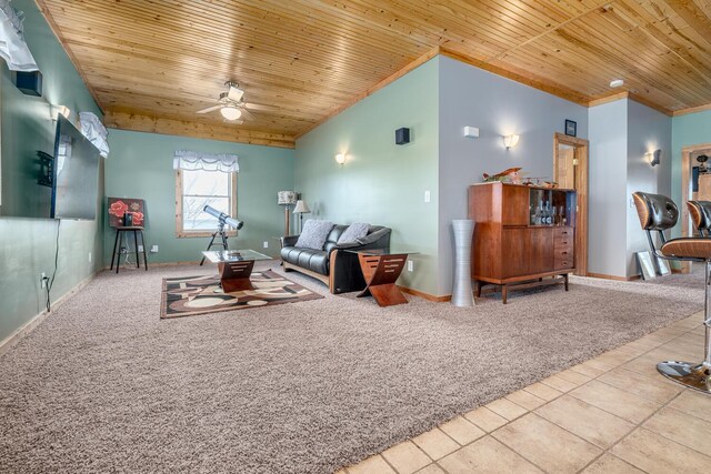 9363 S Grow Rd, Greenville, MI 48838 - tiled living area featuring wooden ceiling, ceiling fan, carpet flooring, baseboards, and ornamental molding