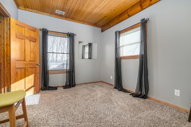 9363 S Grow Rd, Greenville, MI 48838 - carpeted spare room with wood ceiling and baseboards