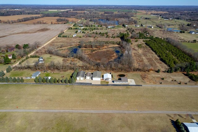 9363 S Grow Rd, Greenville, MI 48838 - aerial overview of property's location with rural landscape and abundant farmland